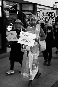 Black and white image of women marching in the Womens Equality March Wagga Wagga