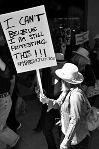 Black and white image of women marching in the Womens Equality March Wagga Wagga